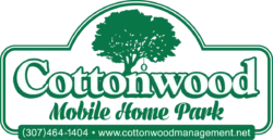 Cottonwood Mobile Home Park logo with tree graphic and contact information
